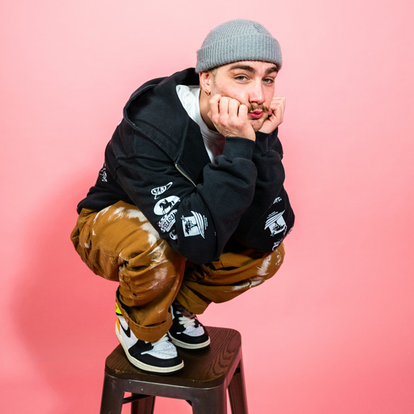 man-perching-on-stool